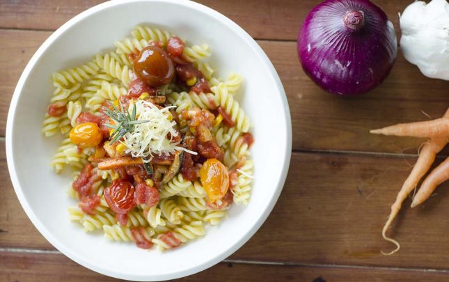 Vegetables and pasta in spiced tomato sauce